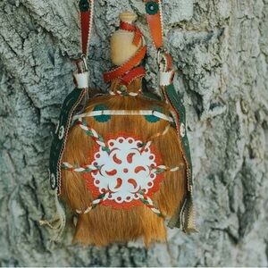 Handmade water flask with fur and leather details